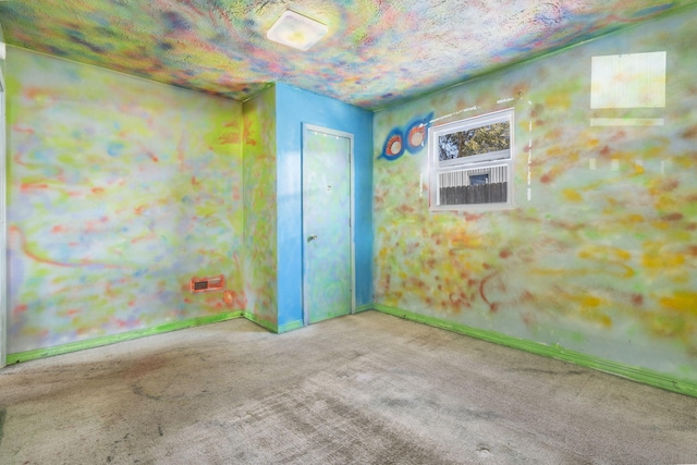 carpeted spare room featuring baseboards and visible vents