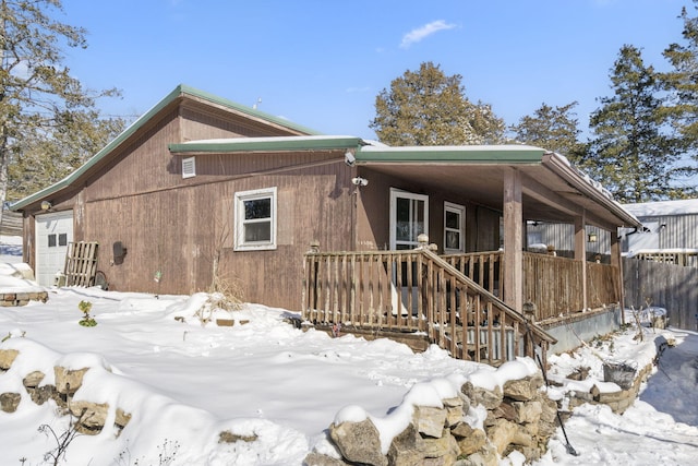 view of front of house featuring a porch and an attached garage