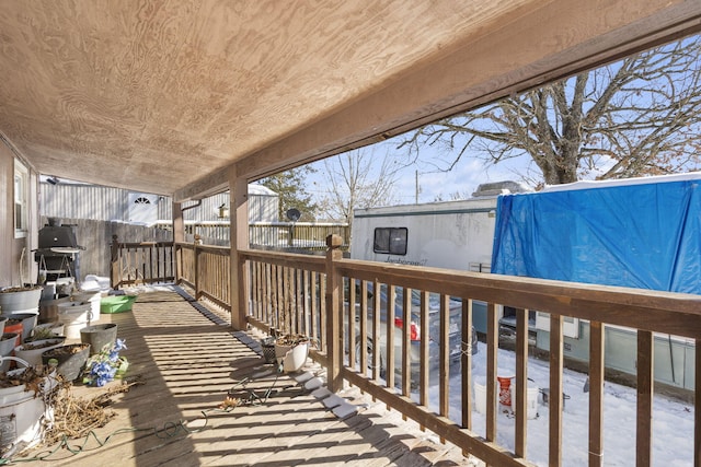 wooden deck with grilling area