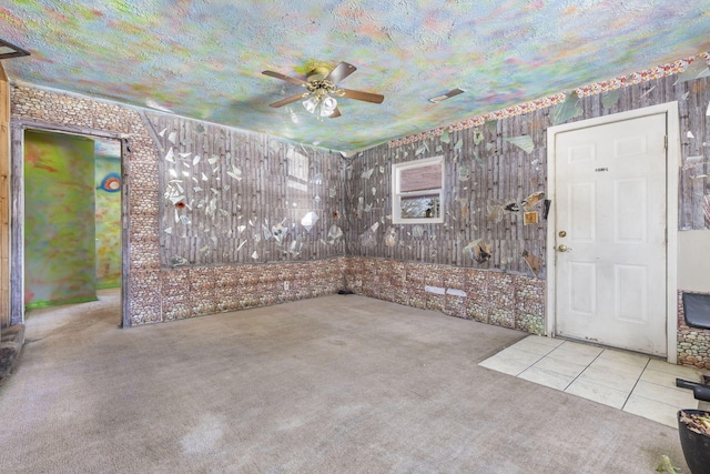 interior space featuring visible vents and ceiling fan