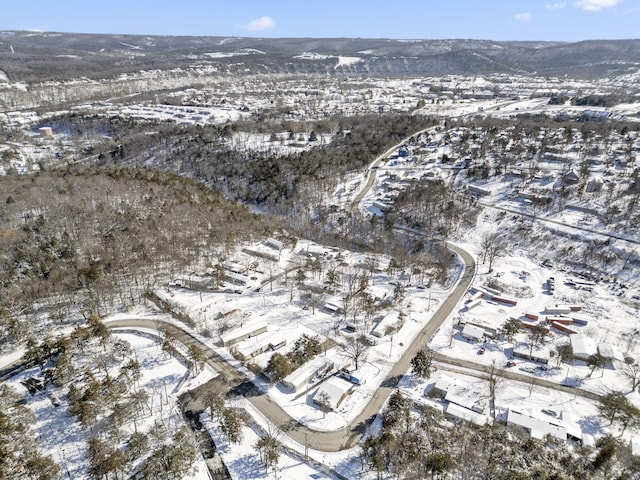 snowy aerial view with a mountain view