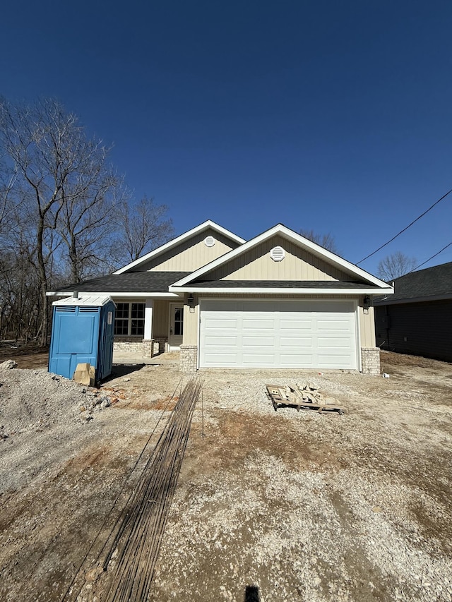 view of front facade with driveway and an attached garage