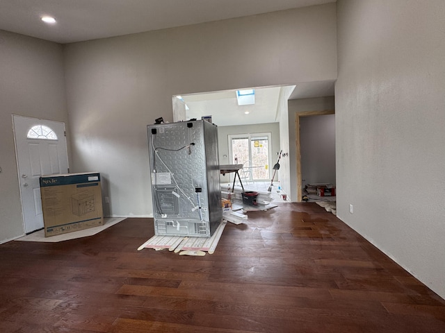 interior space featuring wood finished floors and recessed lighting