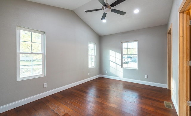 unfurnished room with visible vents, ceiling fan, a wealth of natural light, and dark wood finished floors