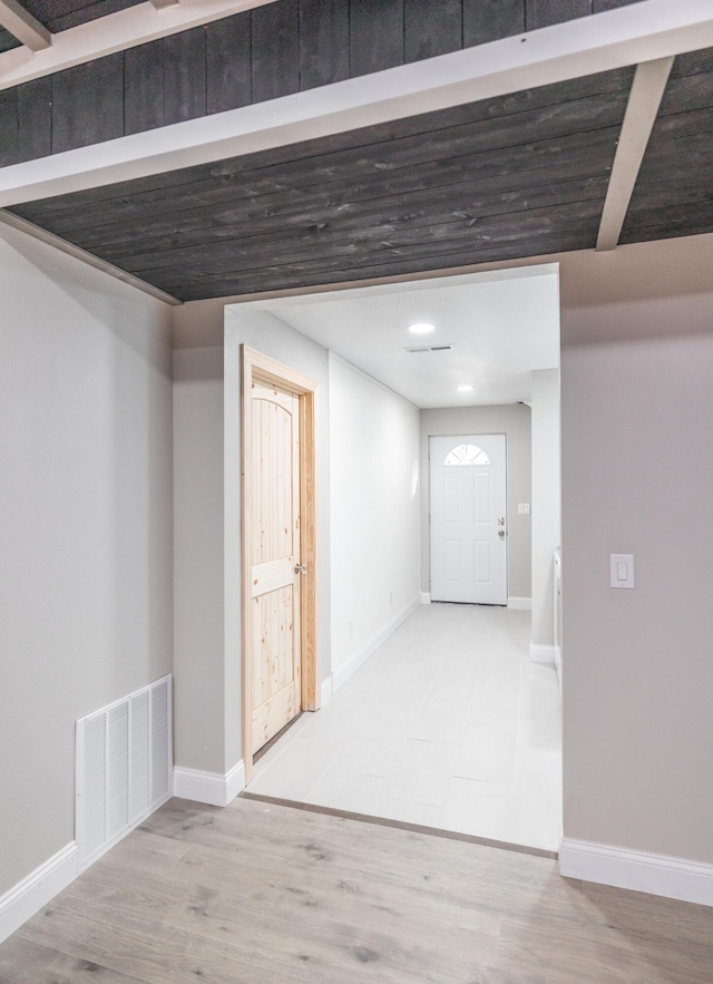 interior space featuring baseboards, visible vents, wood finished floors, and recessed lighting