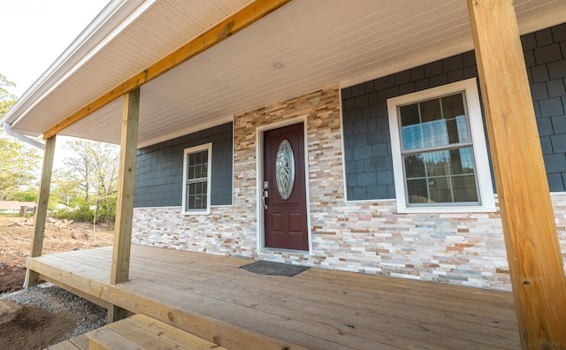 property entrance with covered porch