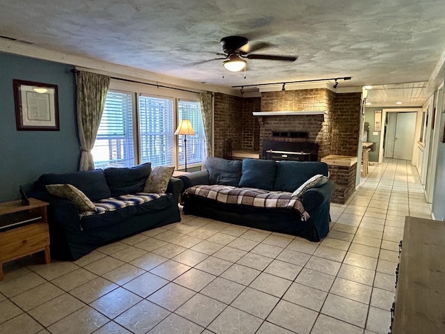 3894 Girlstown Rd, Mountain Grove, MO 65711 - living area featuring light tile patterned flooring, a ceiling fan, a brick fireplace, and track lighting