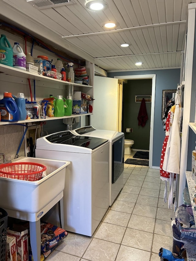 3894 Girlstown Rd, Mountain Grove, MO 65711 - washroom featuring independent washer and dryer, light tile patterned floors, and recessed lighting