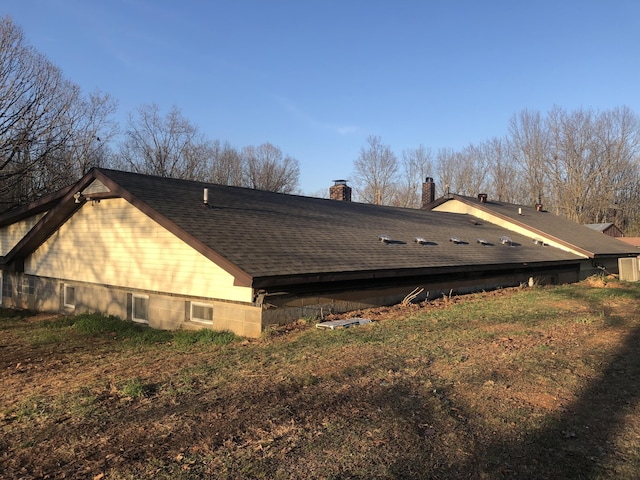 3894 Girlstown Rd, Mountain Grove, MO 65711 - view of property exterior with a chimney and a shingled roof