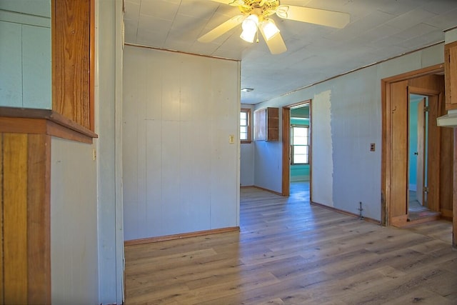 unfurnished room featuring a ceiling fan and wood finished floors