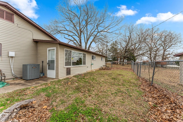 view of yard with central air condition unit and a fenced backyard