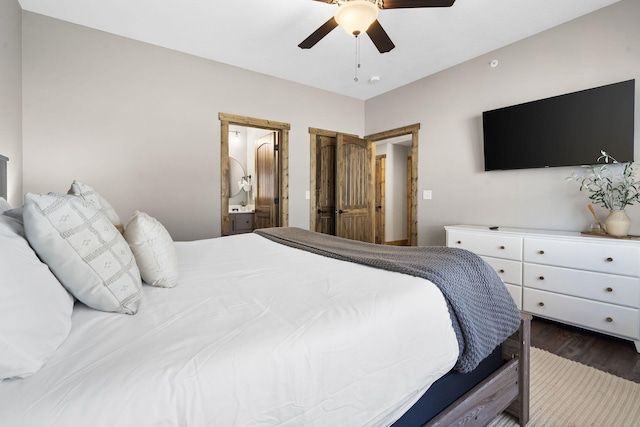 bedroom featuring ensuite bath, ceiling fan, and dark wood-type flooring