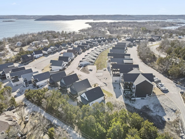 birds eye view of property featuring a residential view and a water view