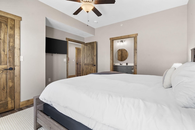 bedroom featuring ceiling fan, wood finished floors, and baseboards