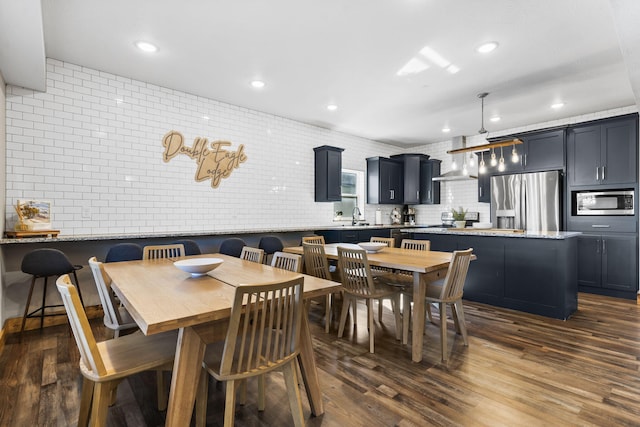 dining area featuring recessed lighting and dark wood-style flooring