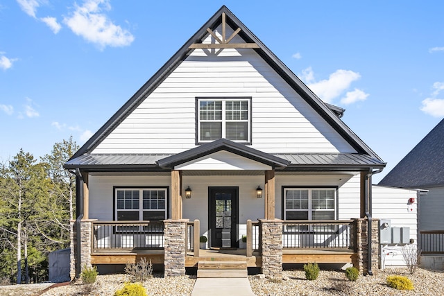 view of front of home with covered porch and metal roof