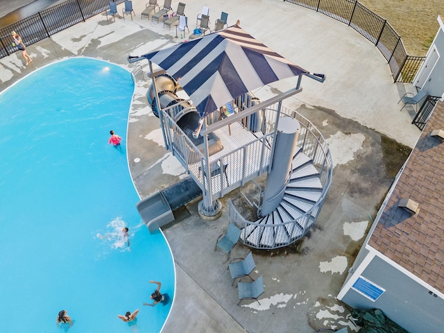 community pool with a water slide