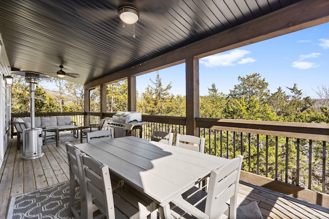 deck featuring an outdoor hangout area, outdoor dining area, a ceiling fan, and area for grilling