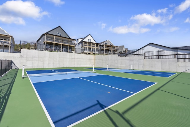 view of sport court with community basketball court and fence