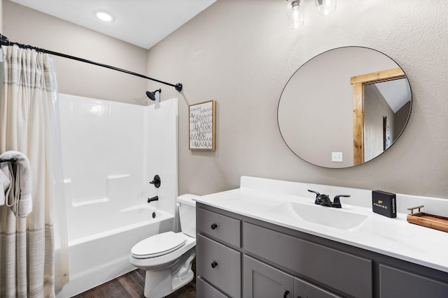 bathroom featuring shower / tub combo, vanity, toilet, and wood finished floors