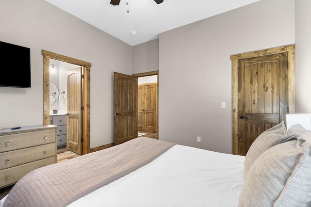 bedroom with ensuite bathroom and a ceiling fan