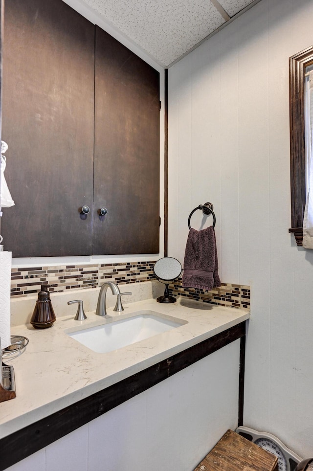 bathroom with backsplash and vanity