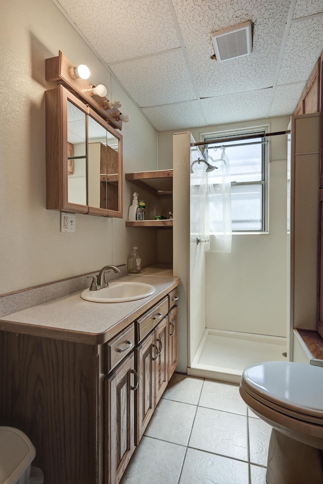 full bathroom with toilet, a shower stall, visible vents, and vanity