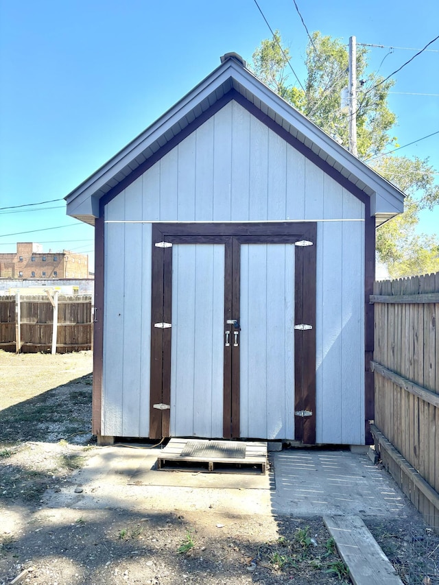 view of shed with fence