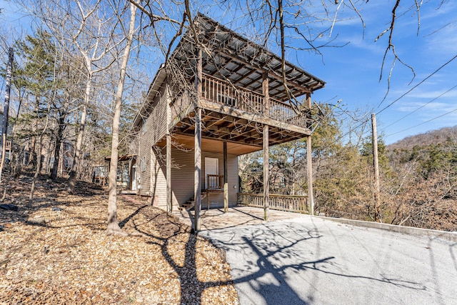 exterior space with driveway and entry steps