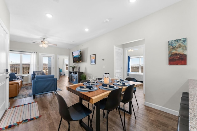 dining room featuring ceiling fan, recessed lighting, wood finished floors, and baseboards