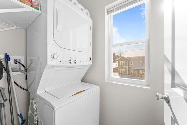 washroom with laundry area and stacked washing maching and dryer