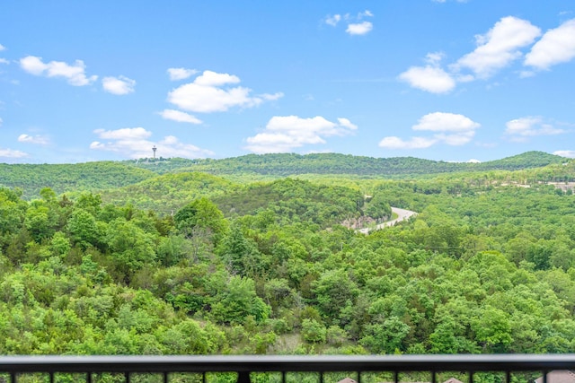 mountain view with a wooded view