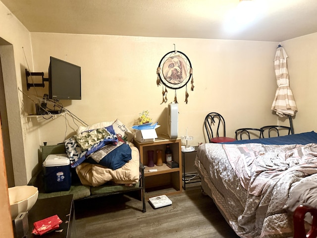 bedroom featuring wood finished floors