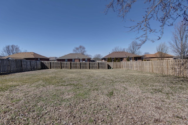 view of yard with a fenced backyard