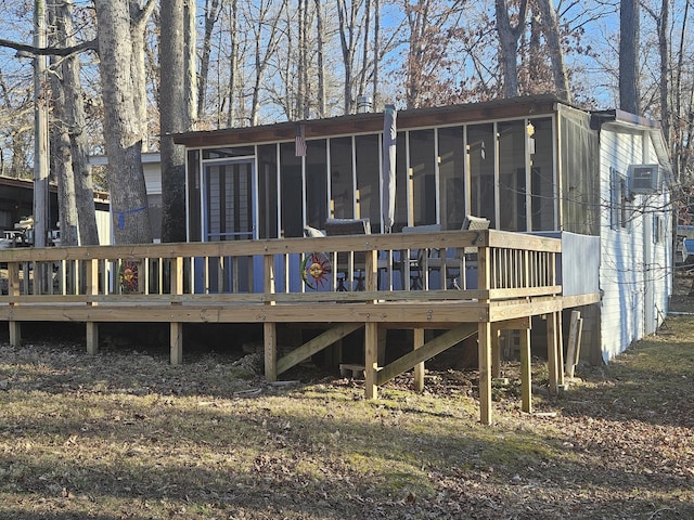 back of house featuring a sunroom