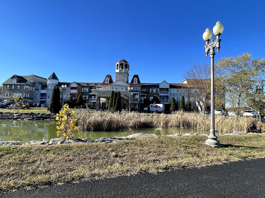 view of building exterior featuring a residential view and a water view