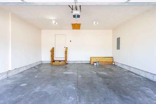 garage with baseboards, electric panel, and a garage door opener