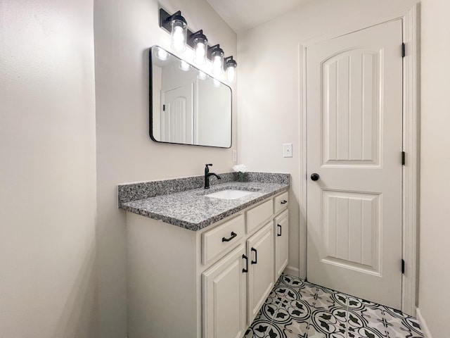 bathroom with tile patterned flooring and vanity