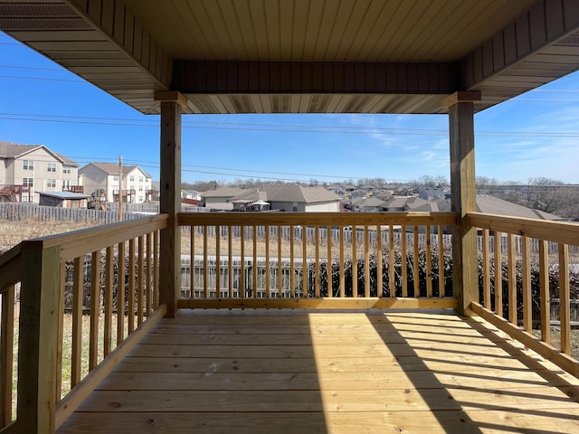 wooden terrace featuring a residential view