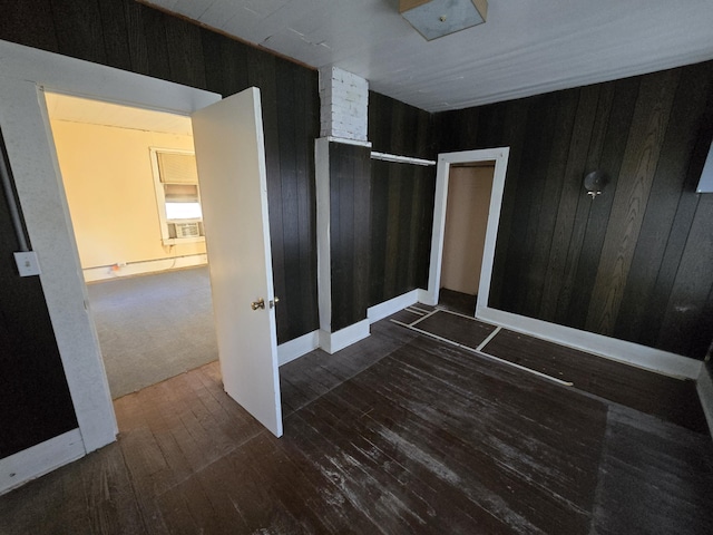 interior space with wood walls and wood-type flooring