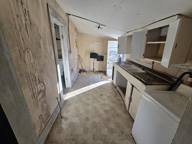 interior space with a sink and washer / dryer