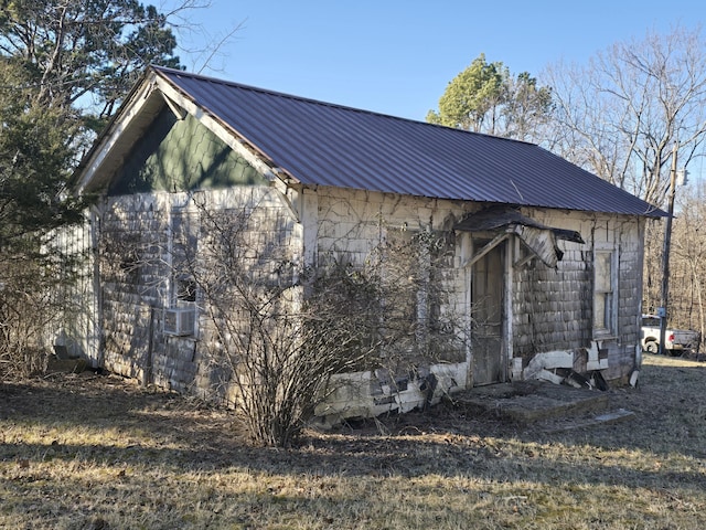 exterior space with metal roof