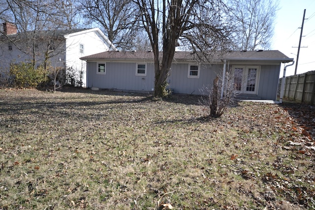 rear view of property with fence