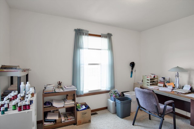 office area with carpet, baseboards, and a wealth of natural light