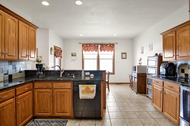 kitchen featuring tasteful backsplash, brown cabinetry, a sink, dishwasher, and a peninsula