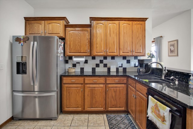 kitchen with dishwashing machine, brown cabinets, a sink, and stainless steel fridge with ice dispenser