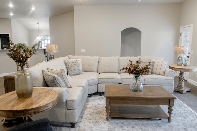 living area featuring recessed lighting, light wood-style flooring, and baseboards