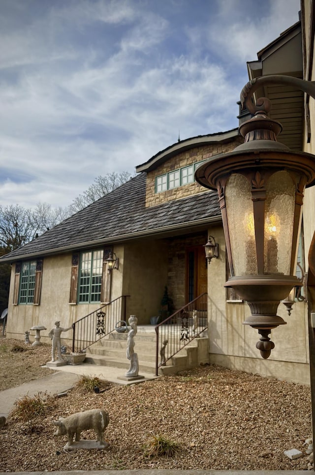 property entrance featuring stucco siding