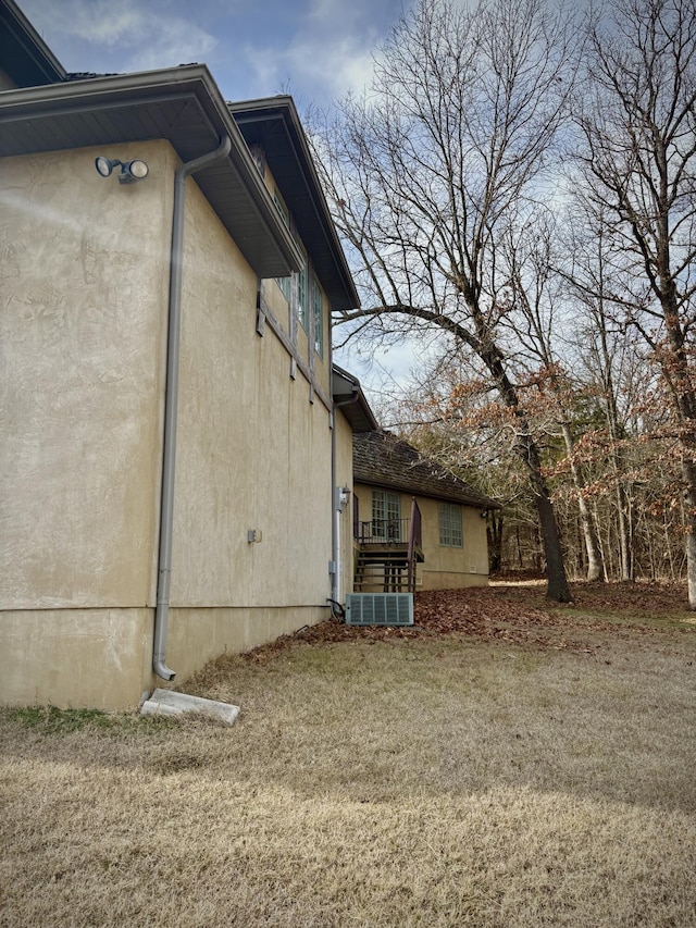 view of side of property with stucco siding