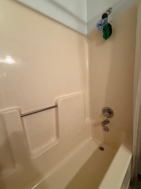 full bathroom with shower / tub combo with curtain